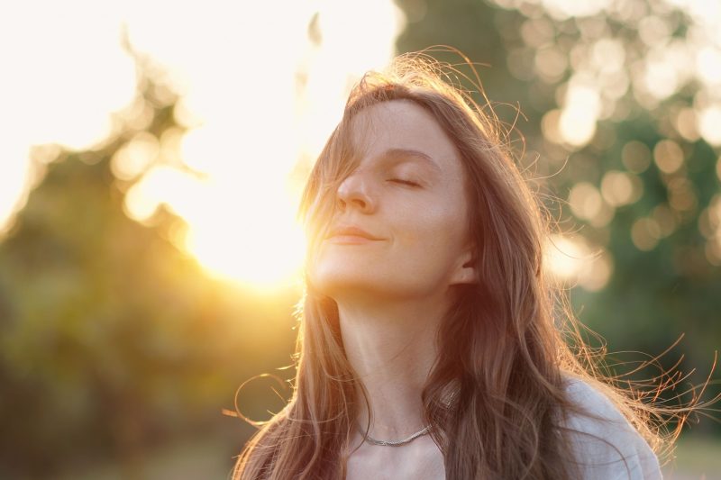 Woman enjoying the sun that will change the rest of her day